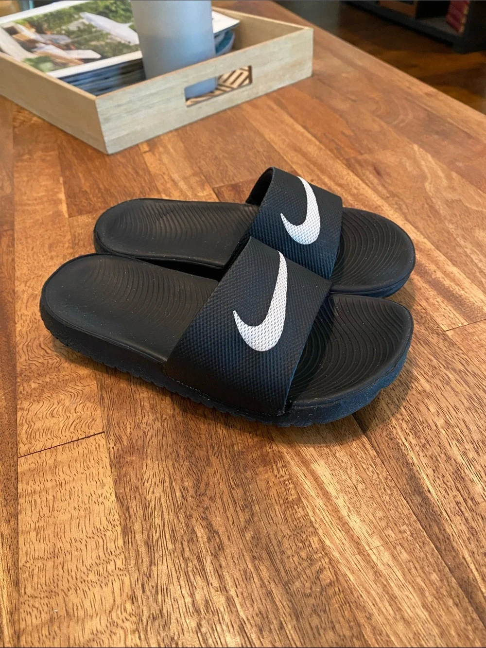 Nike Black Slides with White Swoosh Logo